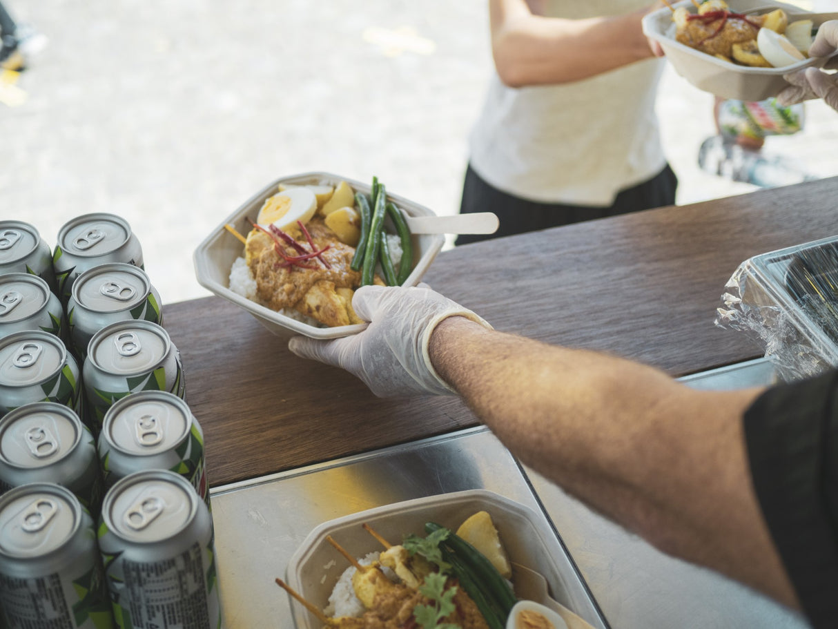 octagonal takeaway container serving food from a food van at a festival