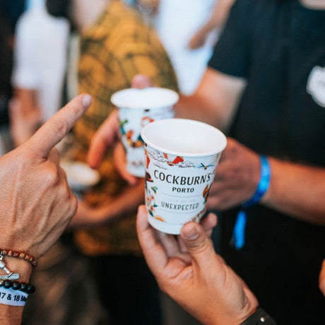 Custom branded double wall coffee cups at a festival with friends serving drinks 