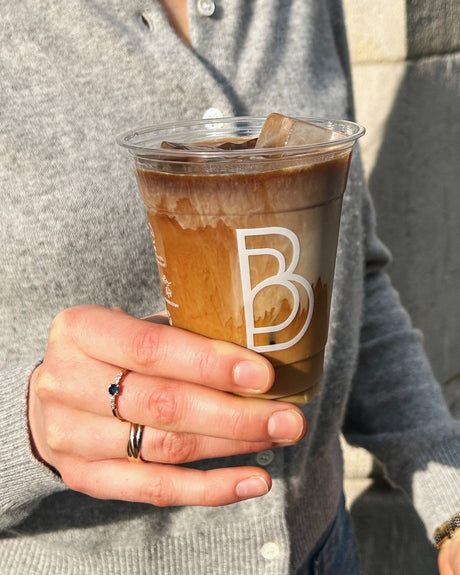 ice coffee in a double sided custom printed disposable clear cup 