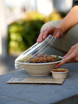 takeaway bagasse bowl with recyclable rpet lid and disposable sauce pot serving a beef ramen dish